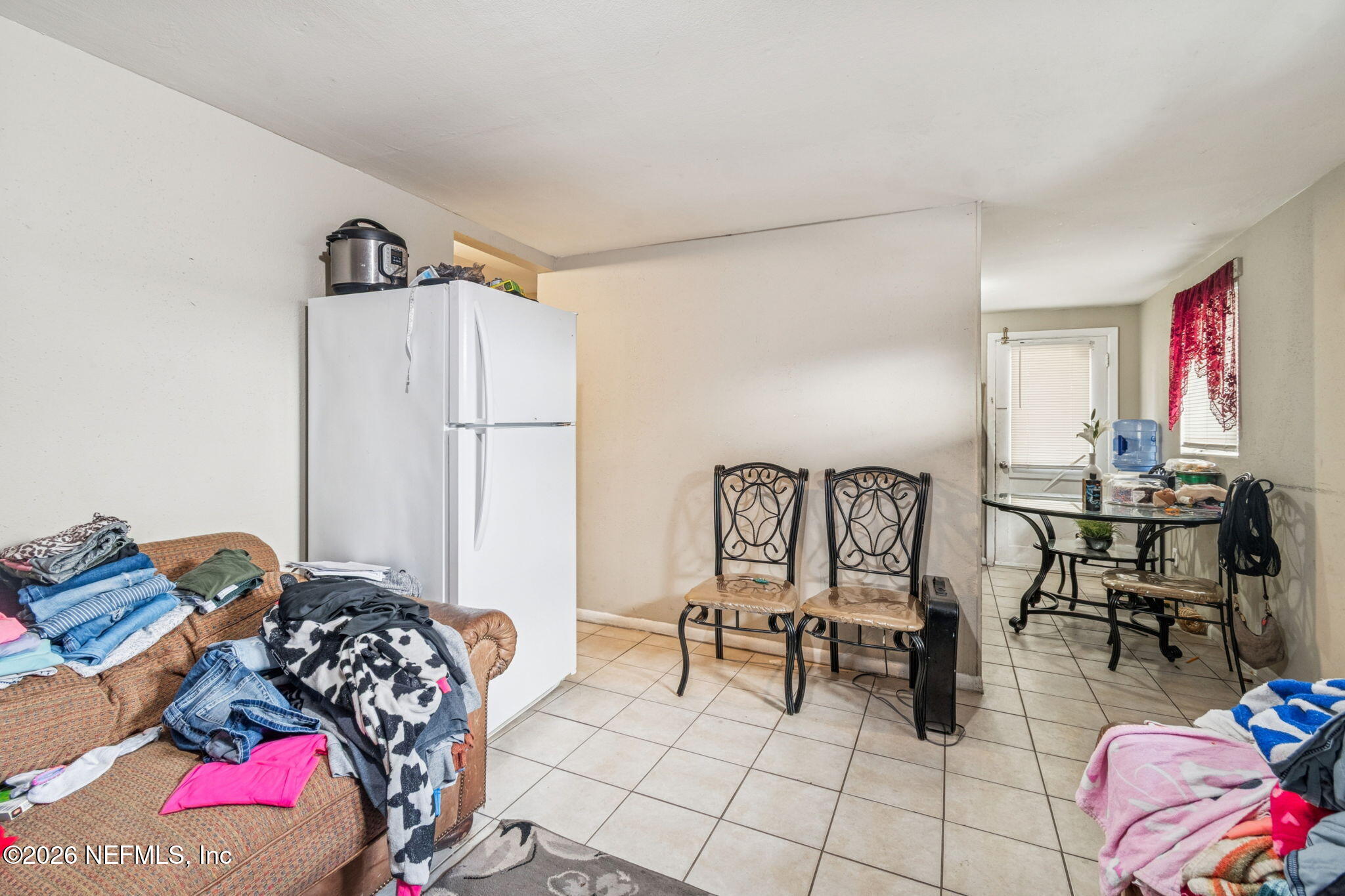 563 Eastport Road Jacksonville, FL 32218 - Photo 26 of 41 a bedroom with furniture and a chair