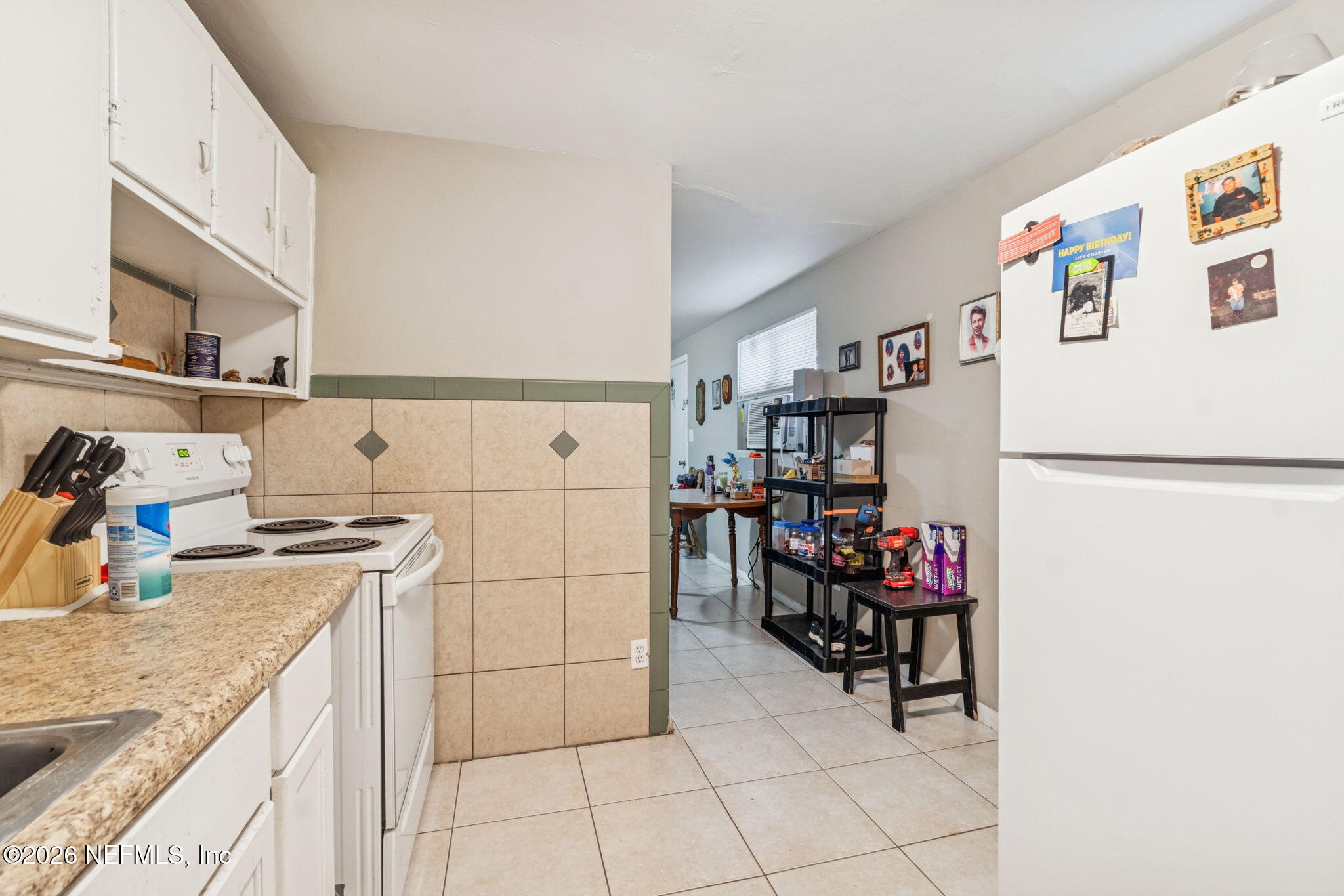 563 Eastport Road Jacksonville, FL 32218 - Photo 31 of 41 a kitchen with a refrigerator and a sink