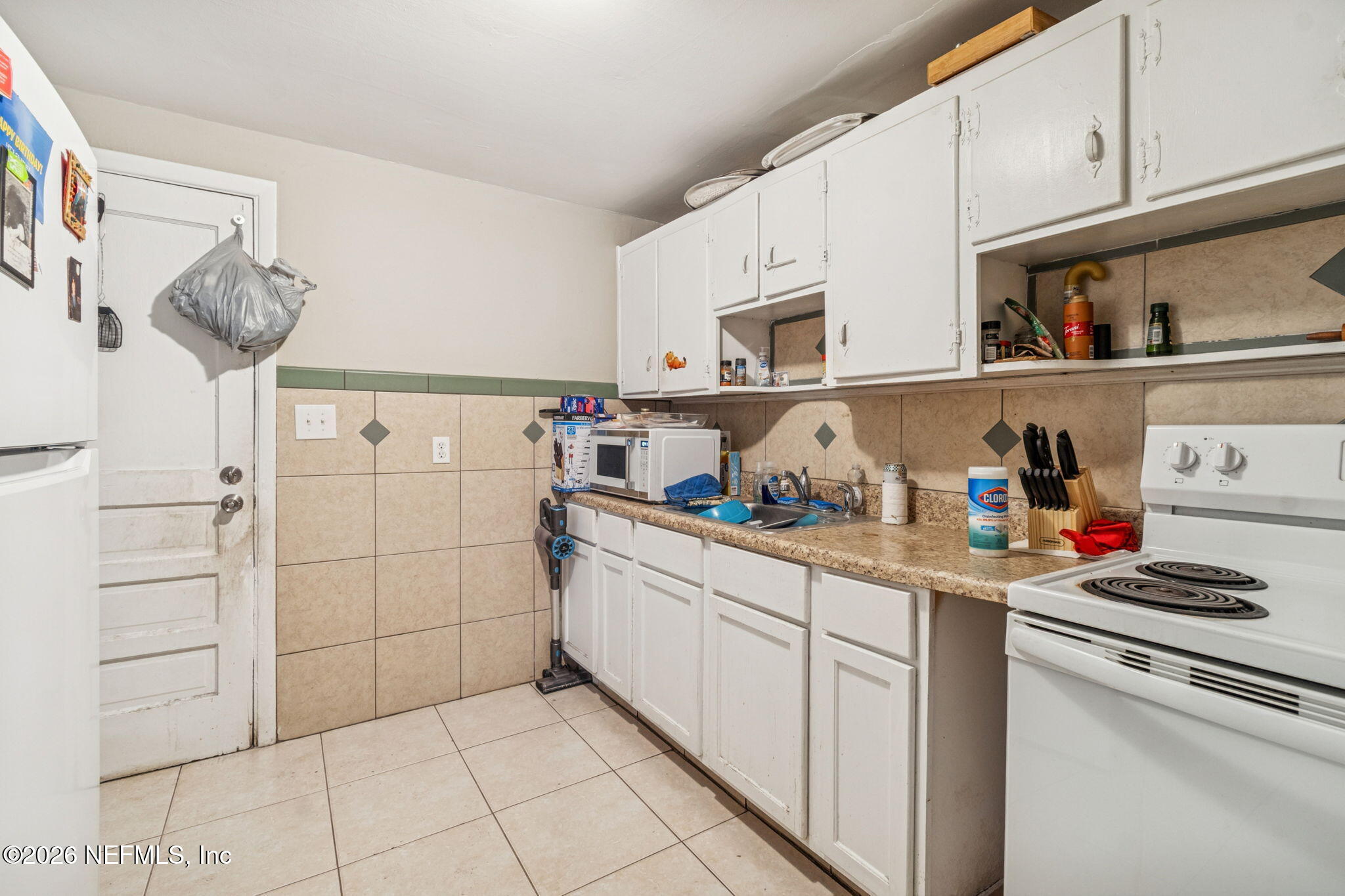 563 Eastport Road Jacksonville, FL 32218 - Photo 33 of 41 a kitchen with stainless steel appliances a sink and cabinets
