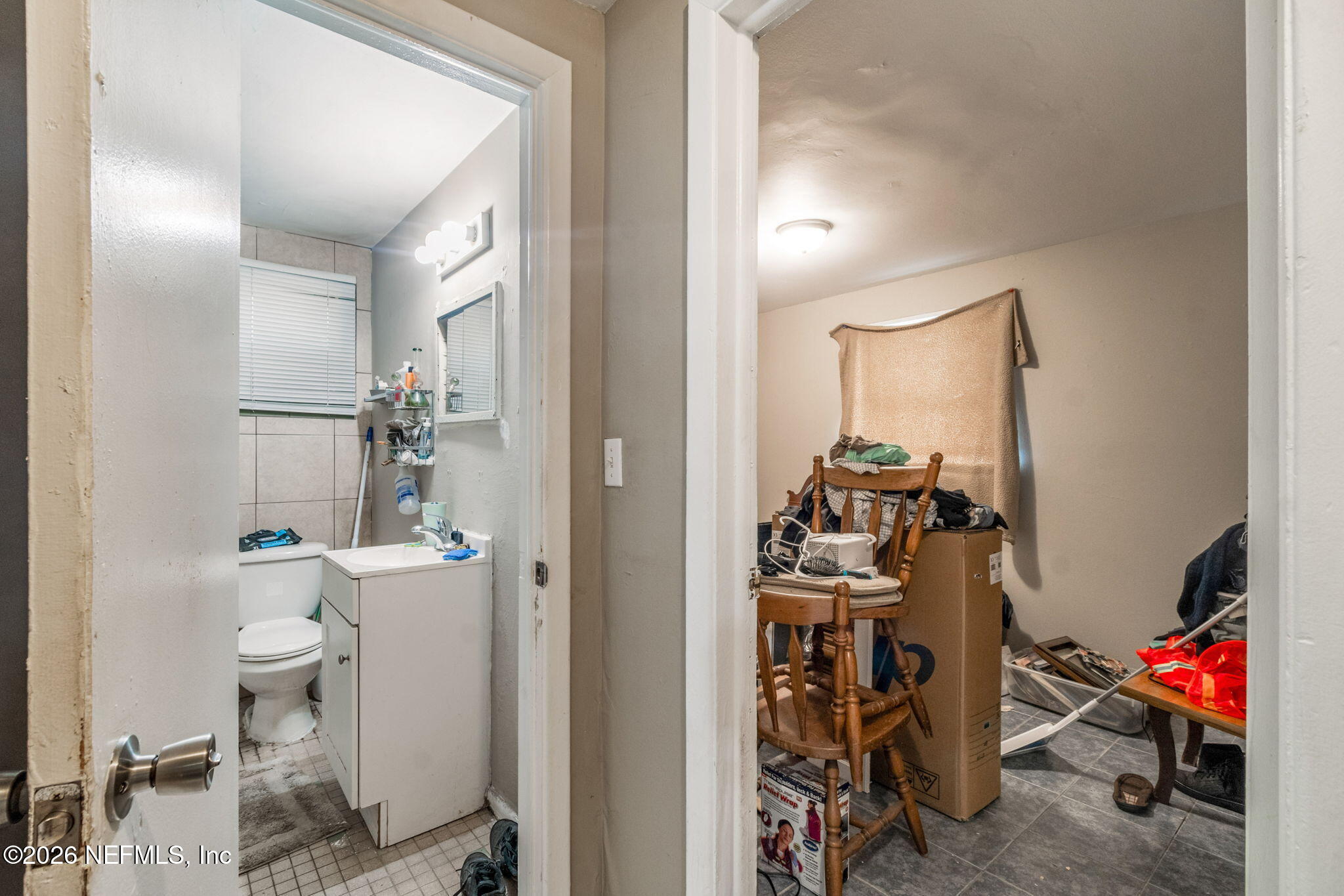 563 Eastport Road Jacksonville, FL 32218 - Photo 34 of 41 a view of a hallway with bathroom and utility room