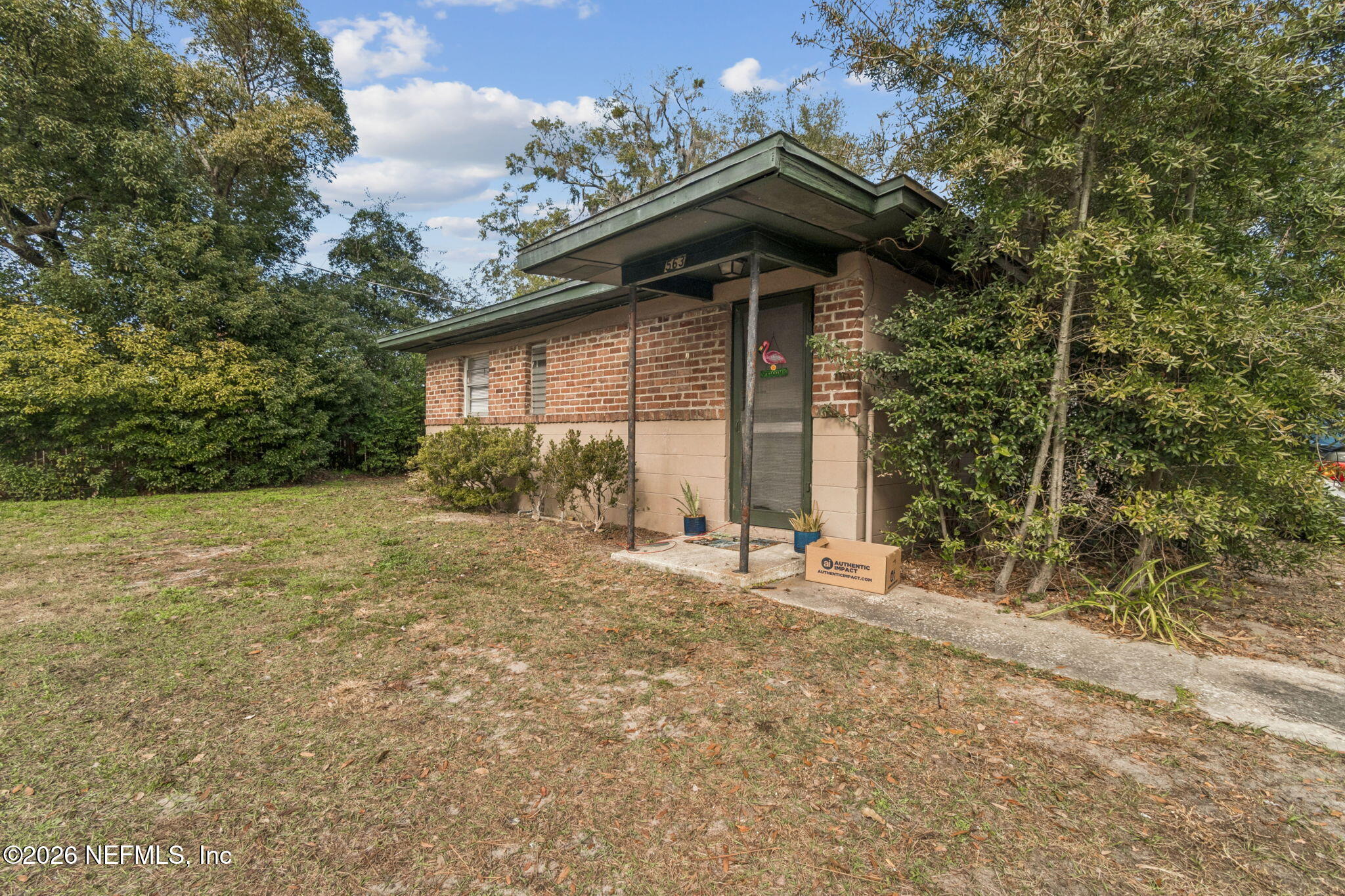 563 Eastport Road Jacksonville, FL 32218 - Photo 37 of 41 a view of a house with a yard