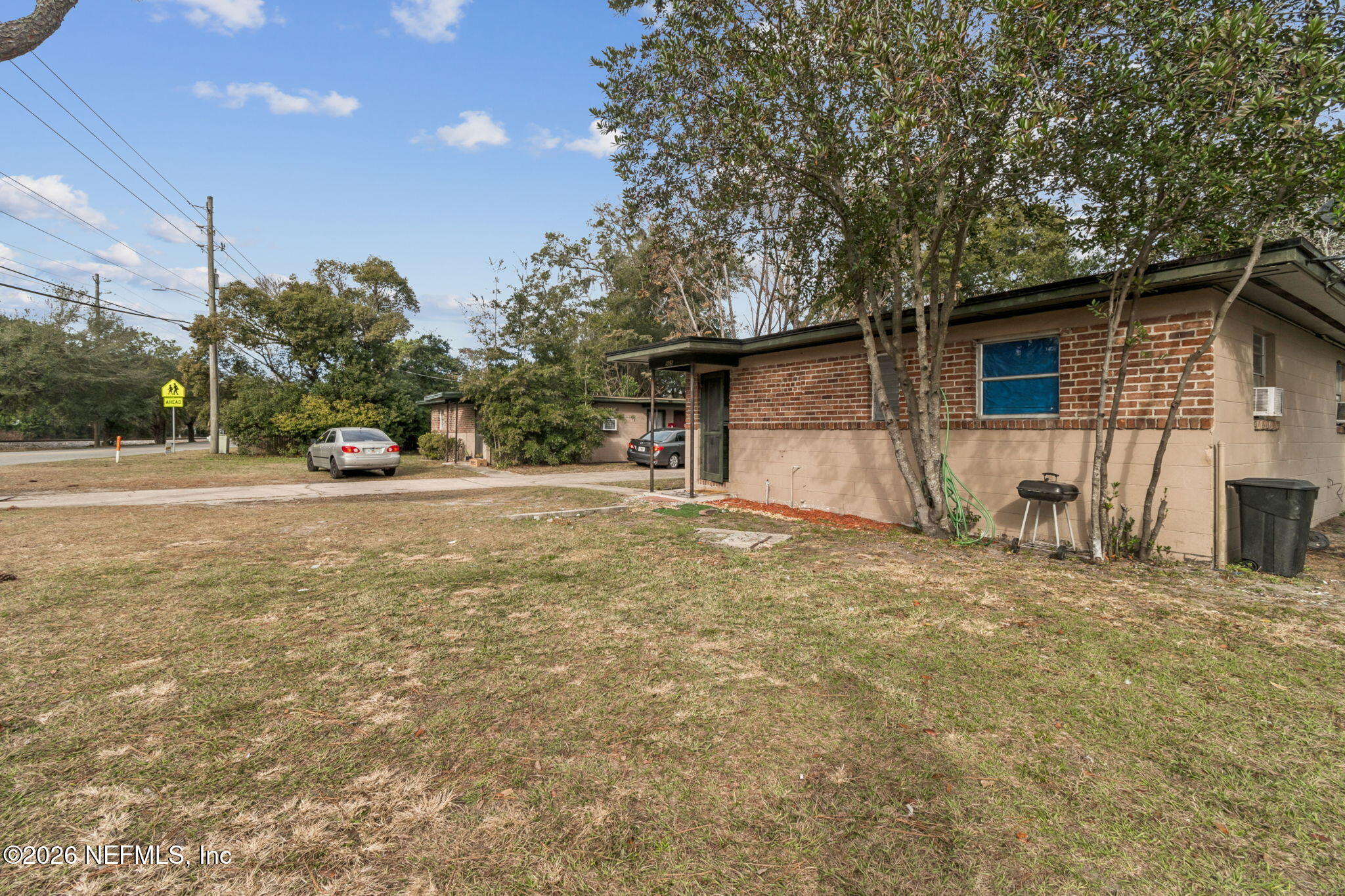 563 Eastport Road Jacksonville, FL 32218 - Photo 5 of 41 a view of a house with a yard and garage