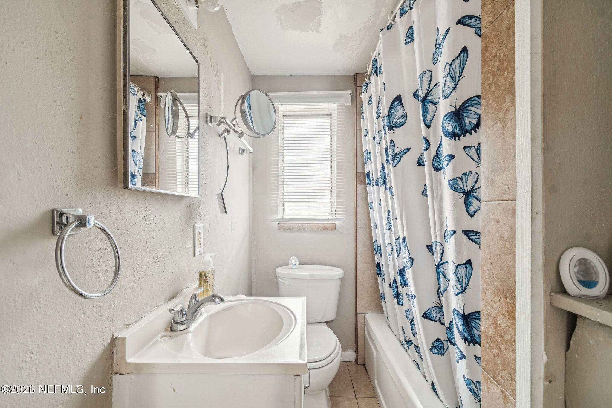 563 Eastport Road Jacksonville, FL 32218 - Photo 9 of 41 a bathroom with a sink and a mirror