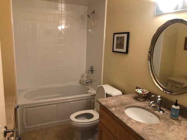 10 Crystal Springs Road, Unit 1509 San Mateo, CA 94402 - Photo 6 of 17 a bathroom with a granite countertop toilet sink and mirror