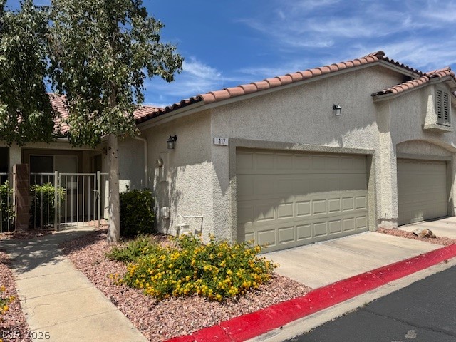117 Tapatio Street Henderson, NV 89074 - Photo 1 of 14 This residence features a stucco exterior and a convenient attached garage.