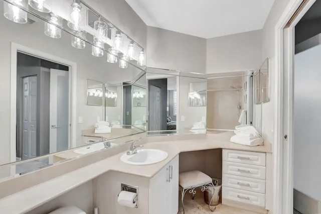 a white bath tub sitting next to a white toilet and a shower