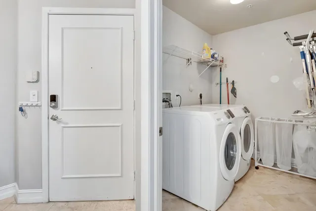 a view of a patio with couches table and chairs and potted plants