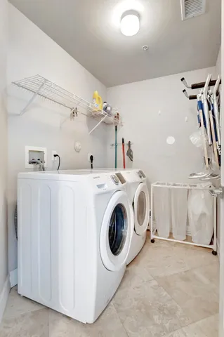 a patio with a table and chairs