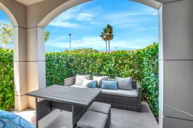 a view of swimming pool with sitting area