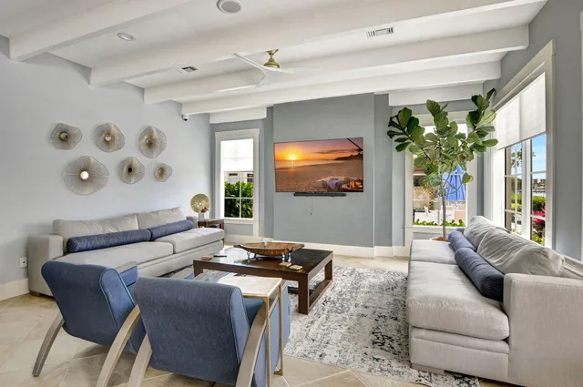 a view of a hallway with a glass door and furniture