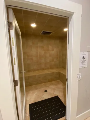 a view of a roof deck with furniture