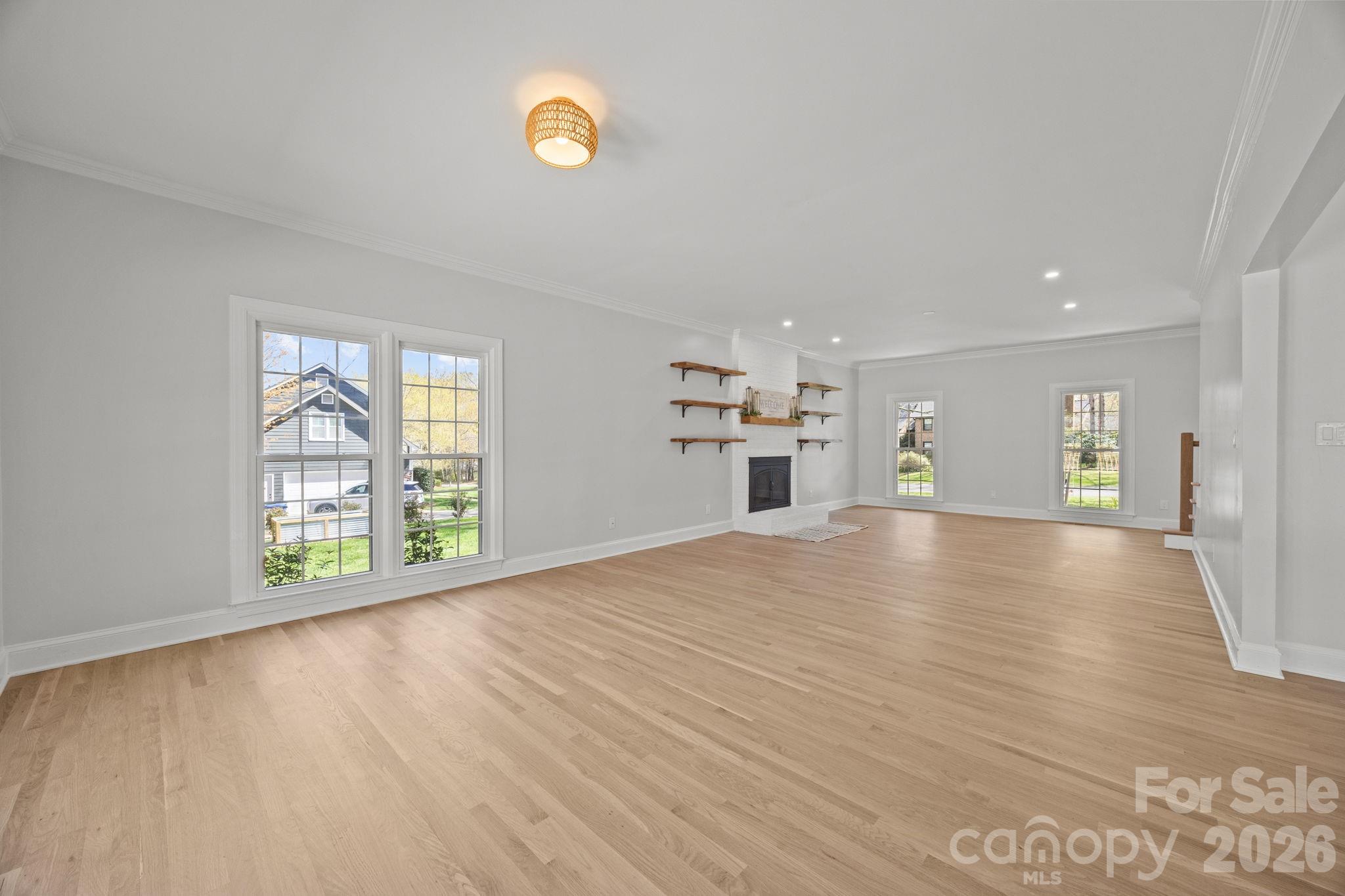 5243 Mintridge Road Mint Hill, NC 28227 - Photo 12 of 43 a view of an empty room with a window and wooden floor