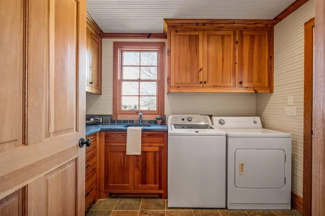 a large bed sitting in a bedroom next to a bathroom
