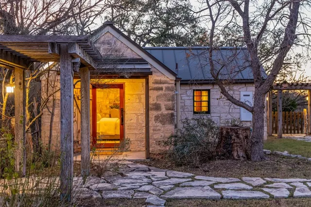 a view of a house with a tree