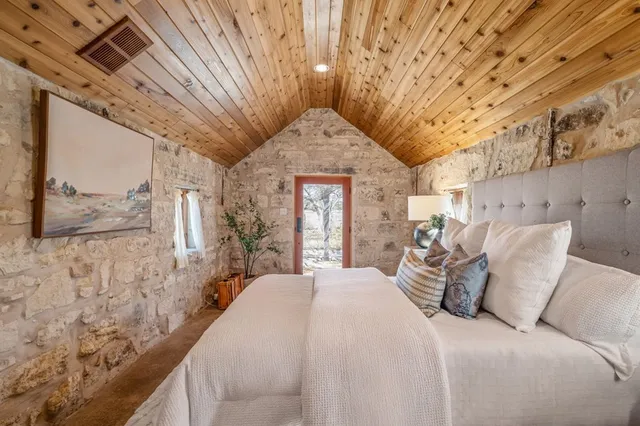 a view of a dry yard with trees