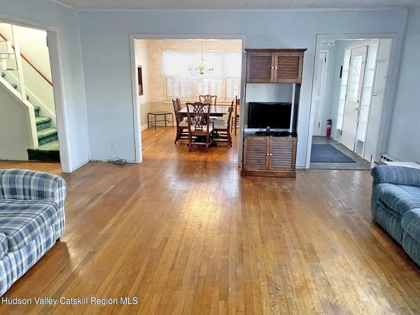 a bed sitting in a room next to a window