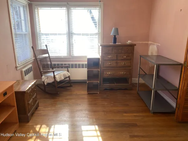 a view of an empty room with stairs