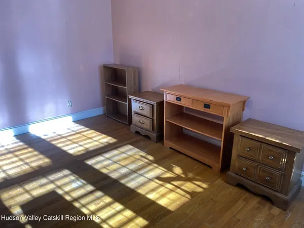 a living room with furniture pool table and a window