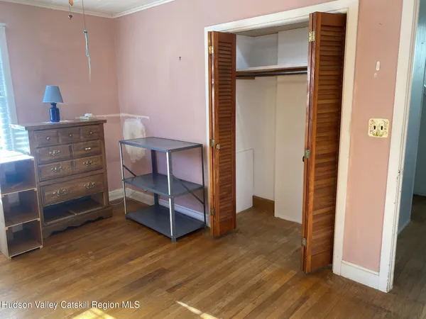 a room with pool table and windows