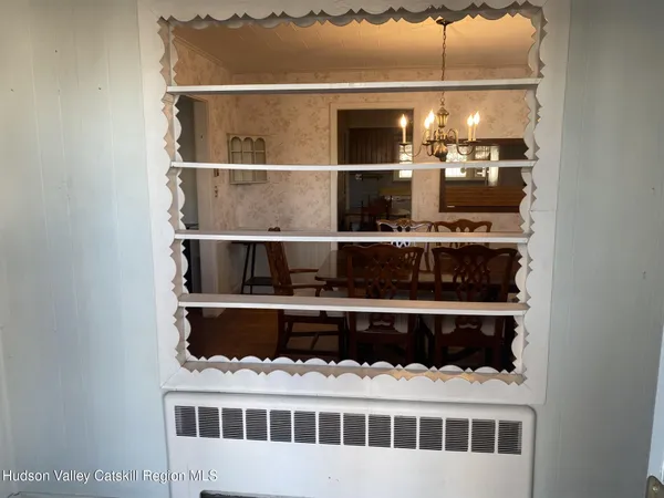 a view of a dining room with furniture and window
