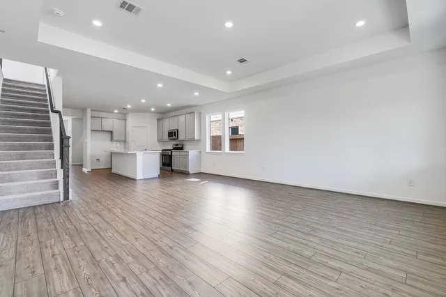 a view of kitchen with furniture and wooden floor
