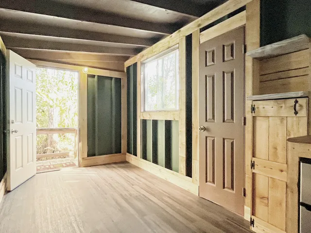 a kitchen with a refrigerator and a sink