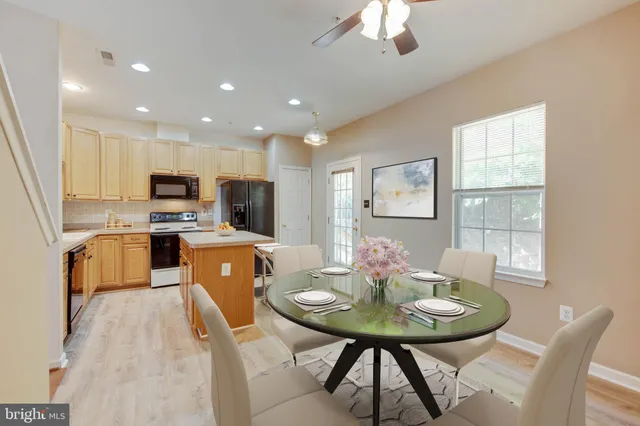 a view of a hallway with wooden floor and entryway