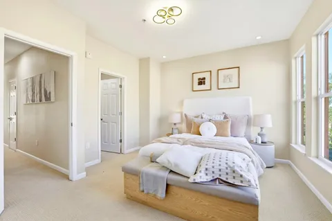 a bedroom with a bed and a view of bedroom