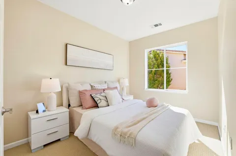 a bedroom with bed and window