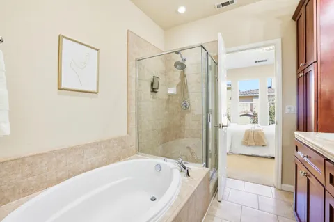 a bathroom with a bathtub and a shower