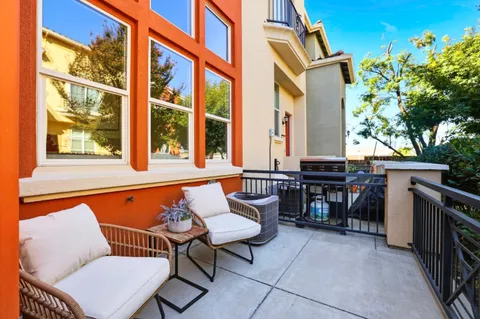 a blue bench sitting in front of a building