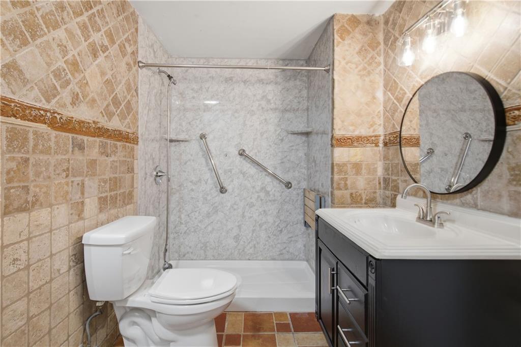 110 Mayes Farm Road Northwest Marietta, GA 30064 - Photo 41 of 49 a bathroom with a sink toilet and shower