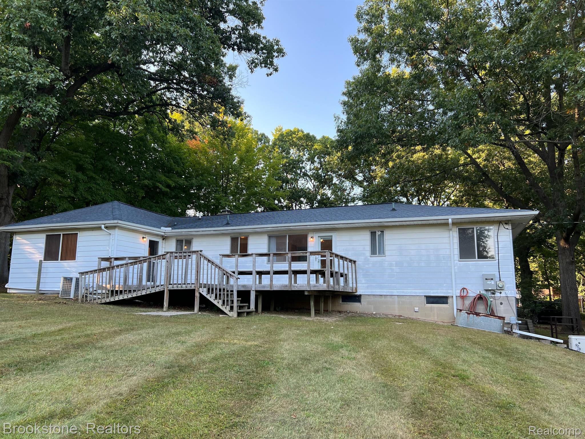2205 Cole Road Lake Orion, MI 48362 - Photo 9 of 55 LG REAR DECK (12X28) IS USED TO ENTERTAIN