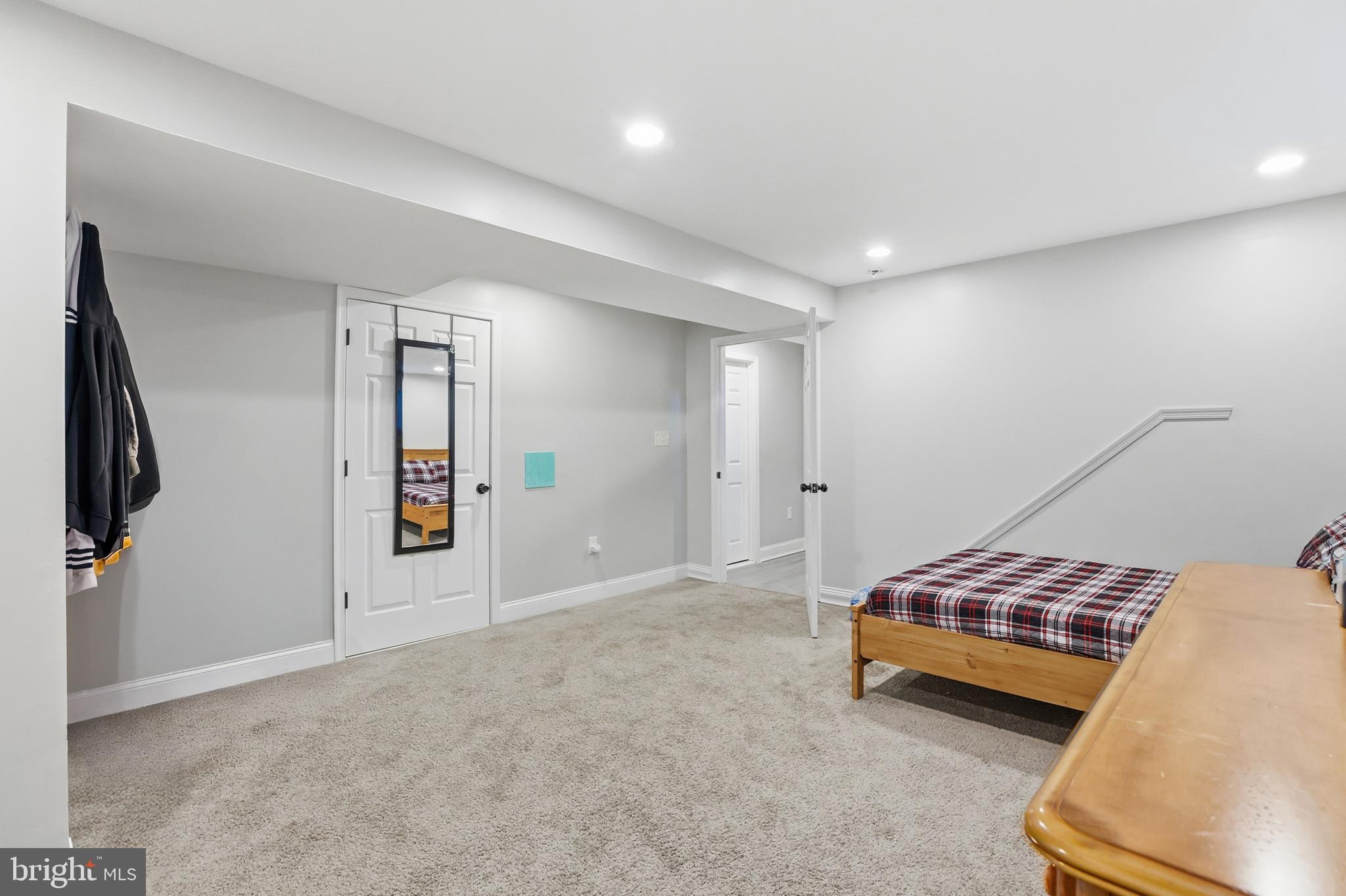 211 Jack Street Baltimore, MD 21225 - Photo 15 of 29 a bedroom with furniture and closet