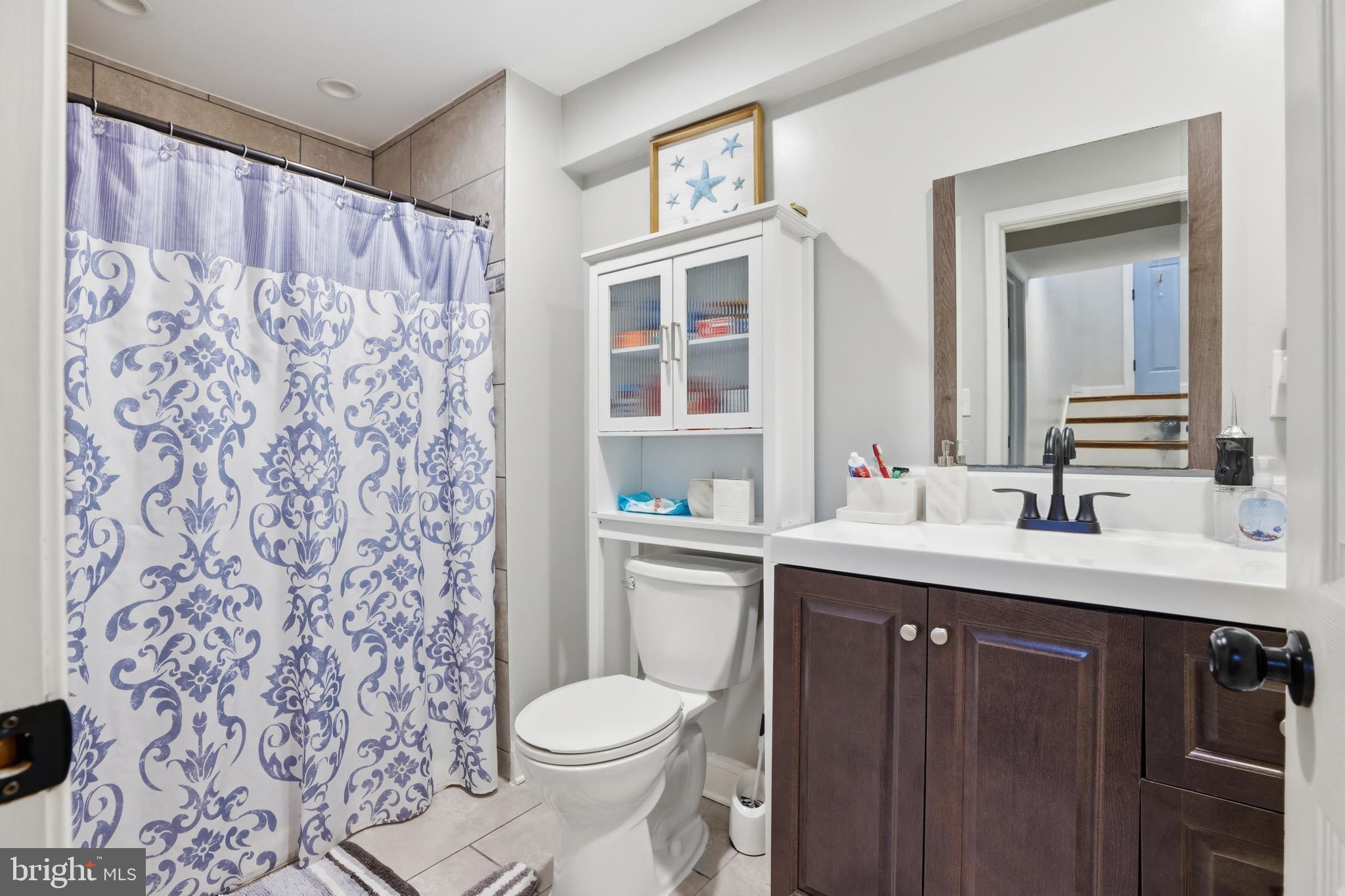 211 Jack Street Baltimore, MD 21225 - Photo 17 of 29 a bathroom with a sink and a toilet