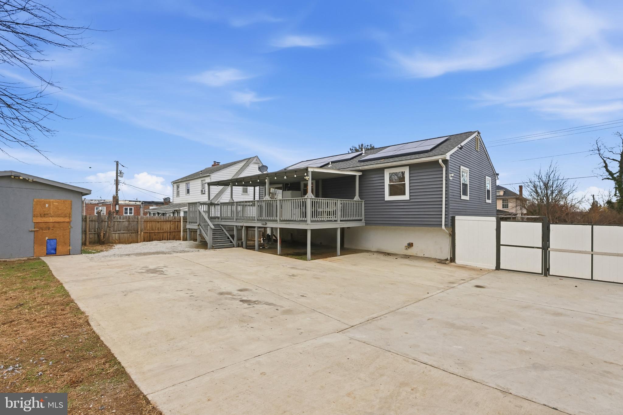211 Jack Street Baltimore, MD 21225 - Photo 19 of 29 a view of a house with a roof deck