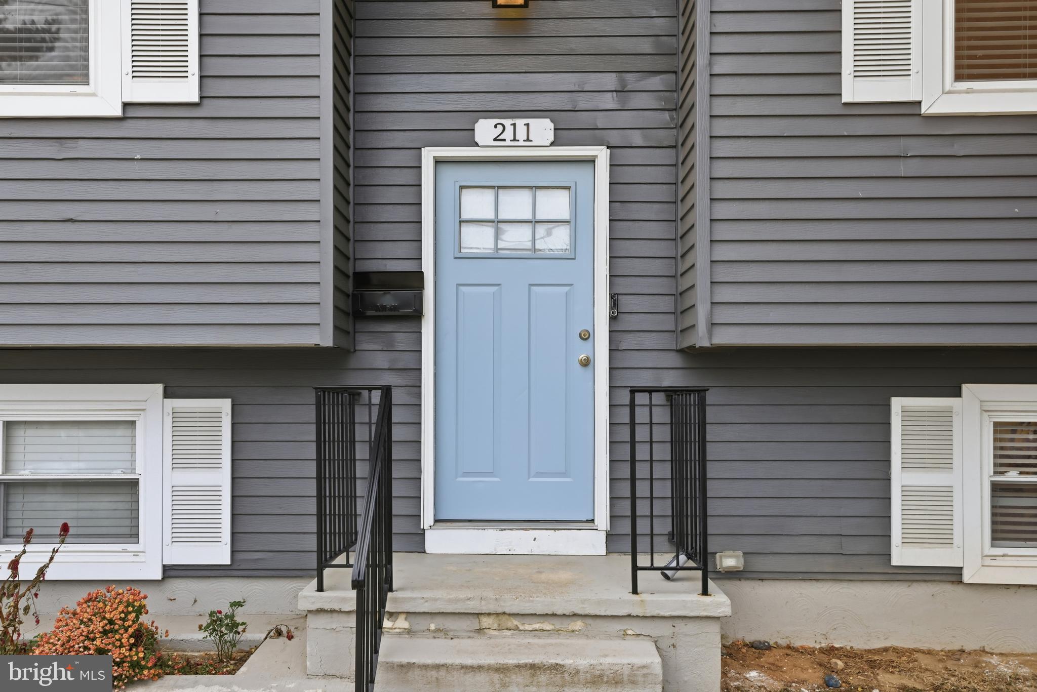 211 Jack Street Baltimore, MD 21225 - Photo 2 of 29 a front view of a house with entryway