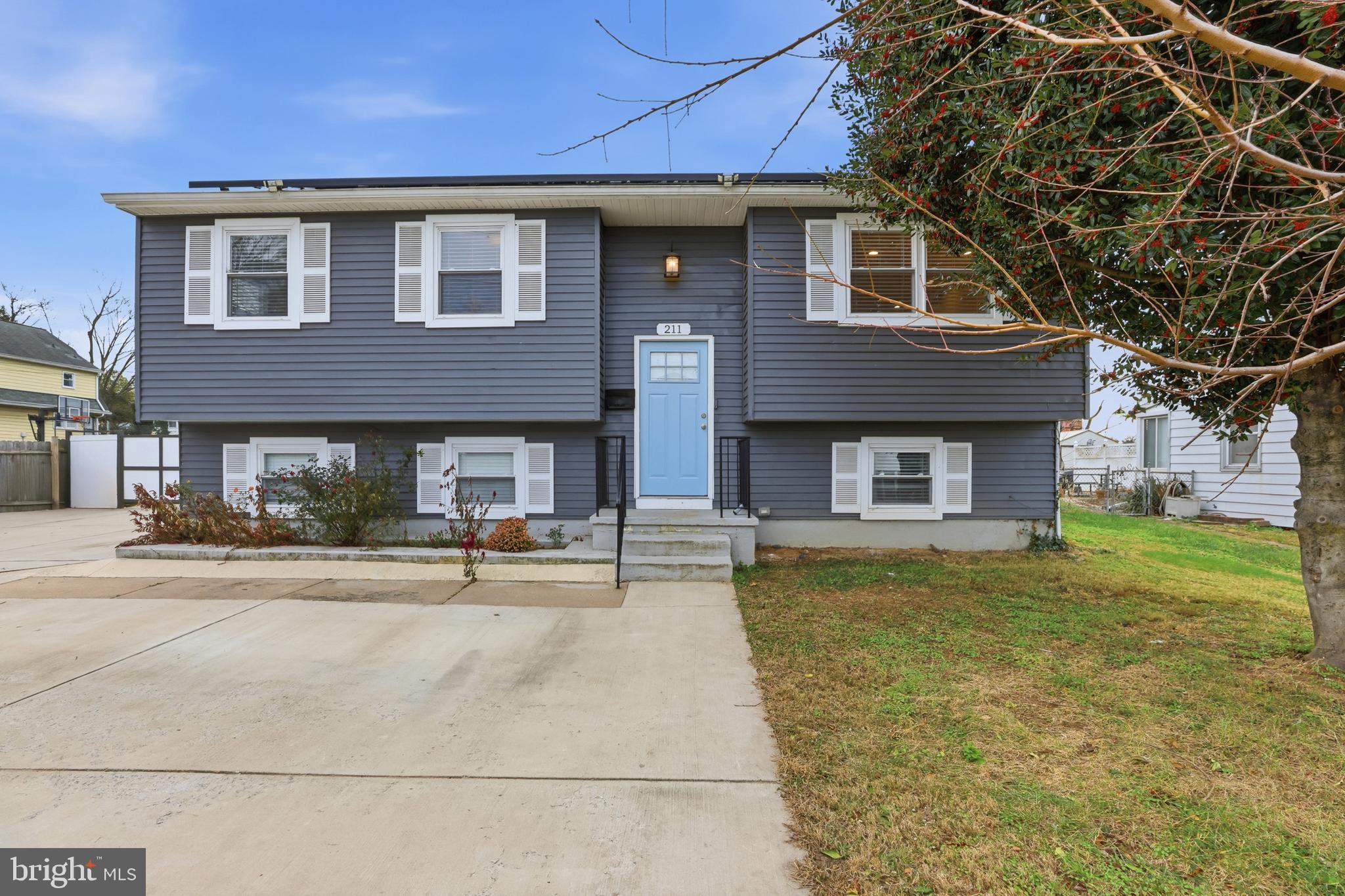 211 Jack Street Baltimore, MD 21225 - Photo 24 of 29 a front view of a house with swimming pool and a fire pit