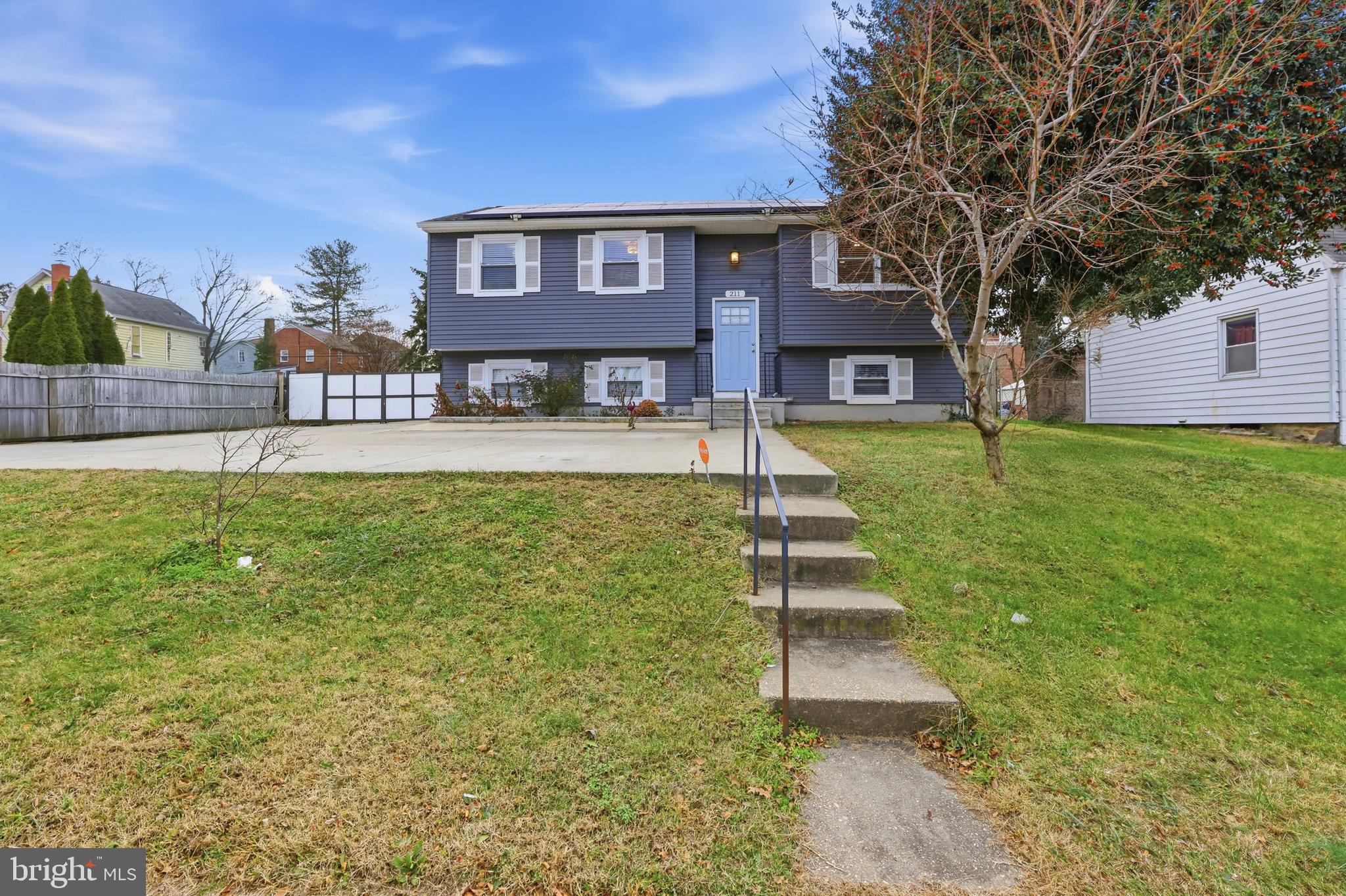 211 Jack Street Baltimore, MD 21225 - Photo 25 of 29 a front view of a house with a yard