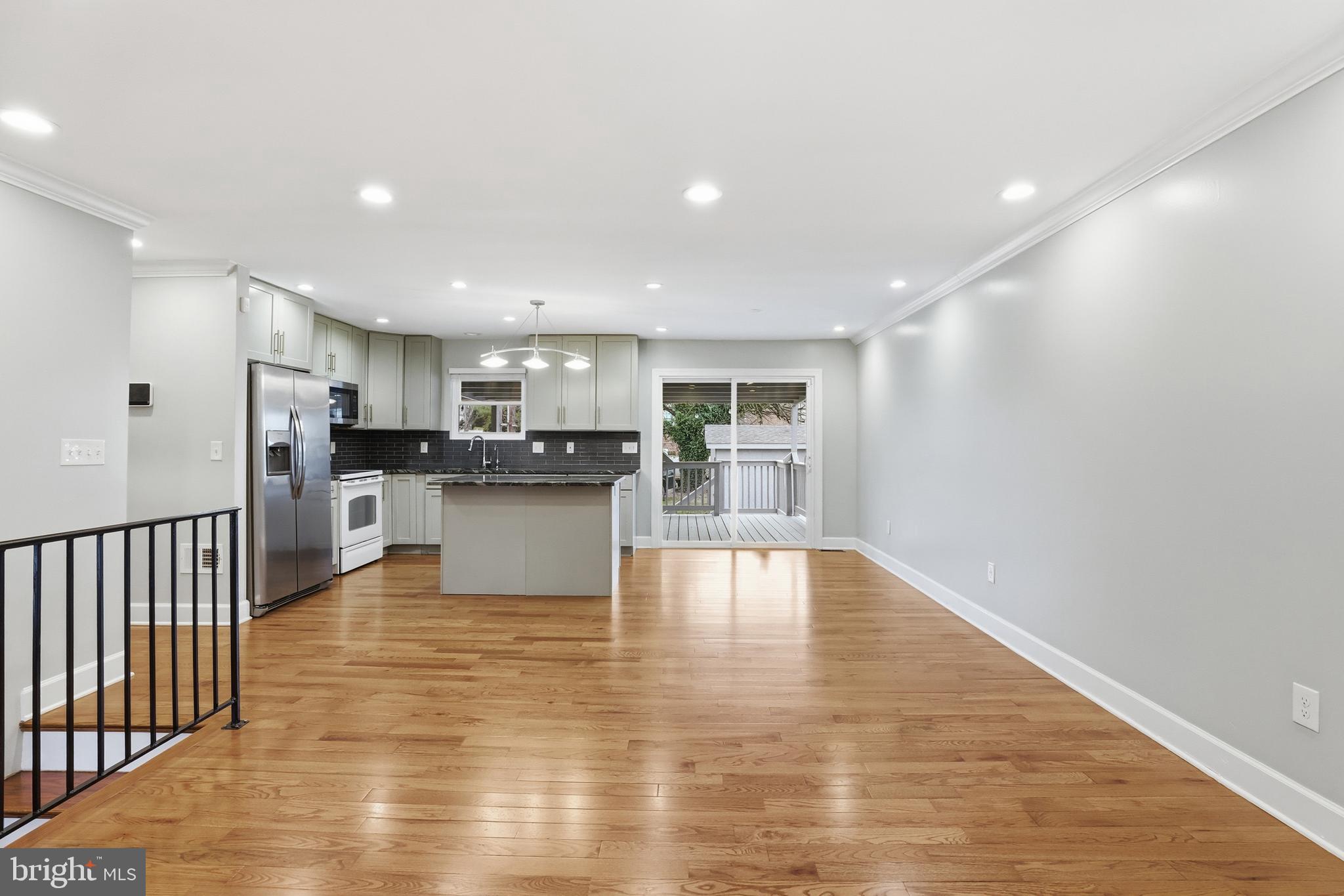 211 Jack Street Baltimore, MD 21225 - Photo 6 of 29 a view of kitchen with wooden floor
