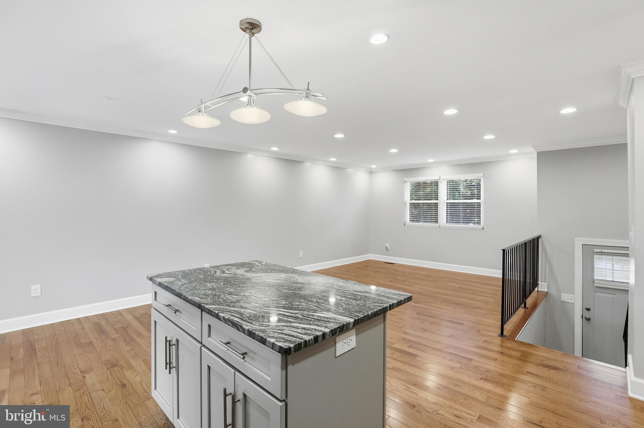 211 Jack Street Baltimore, MD 21225 - Photo 9 of 29 an open kitchen with sink and breakfast area