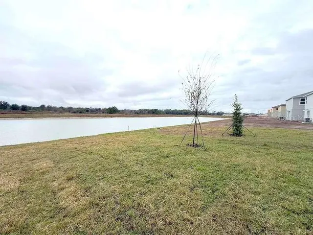 a view of a lake with a big yard