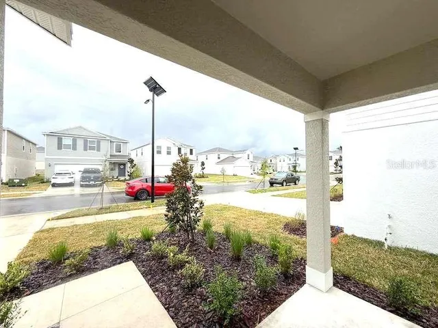a view of a swimming pool with a balcony