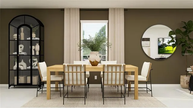 a view of a dining room with furniture and a window