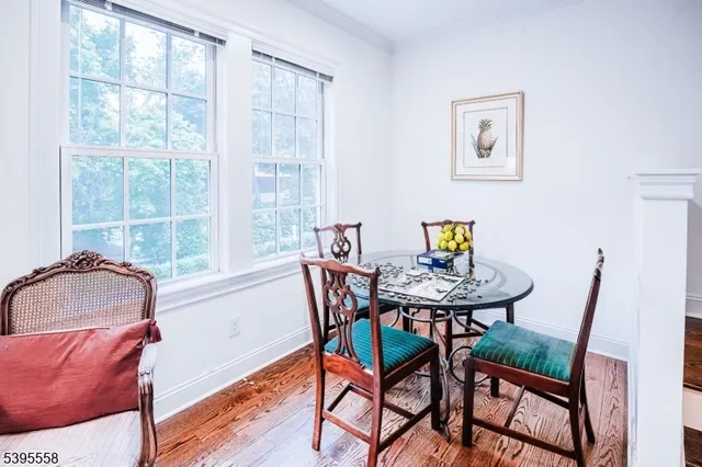 a view of a dining room with furniture and a window