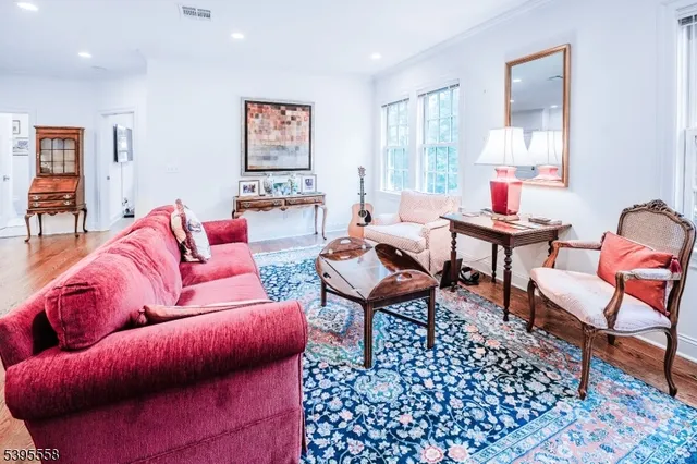 a living room with furniture and a rug