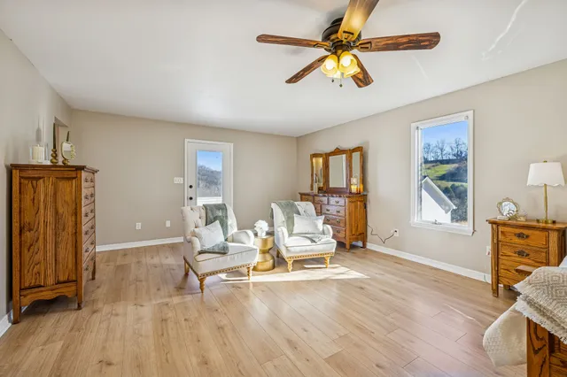 a bedroom with a bed and a refrigerator