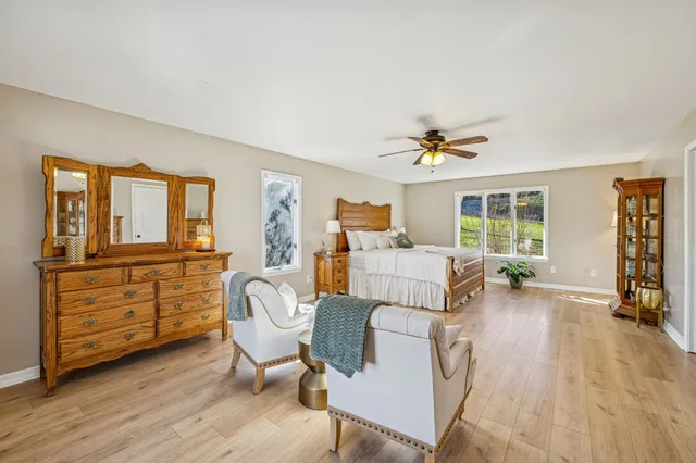 a view of a patio with table and chairs under an umbrella