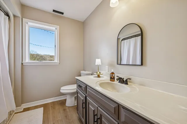 a view of a backyard with chairs