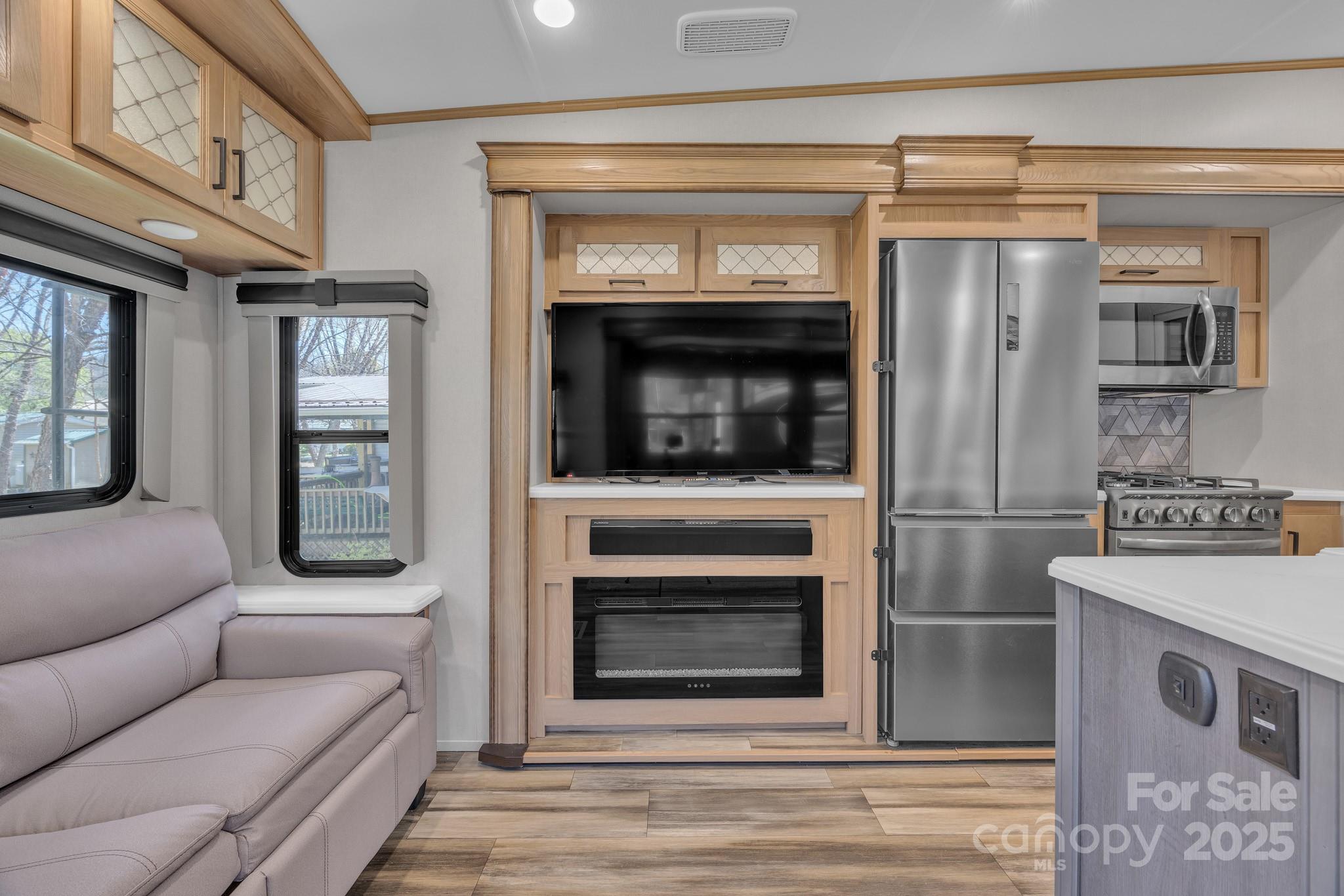 195 Finch Way, Unit 7 West Jefferson, NC 28694 - Photo 12 of 39 a living room with furniture and a fireplace